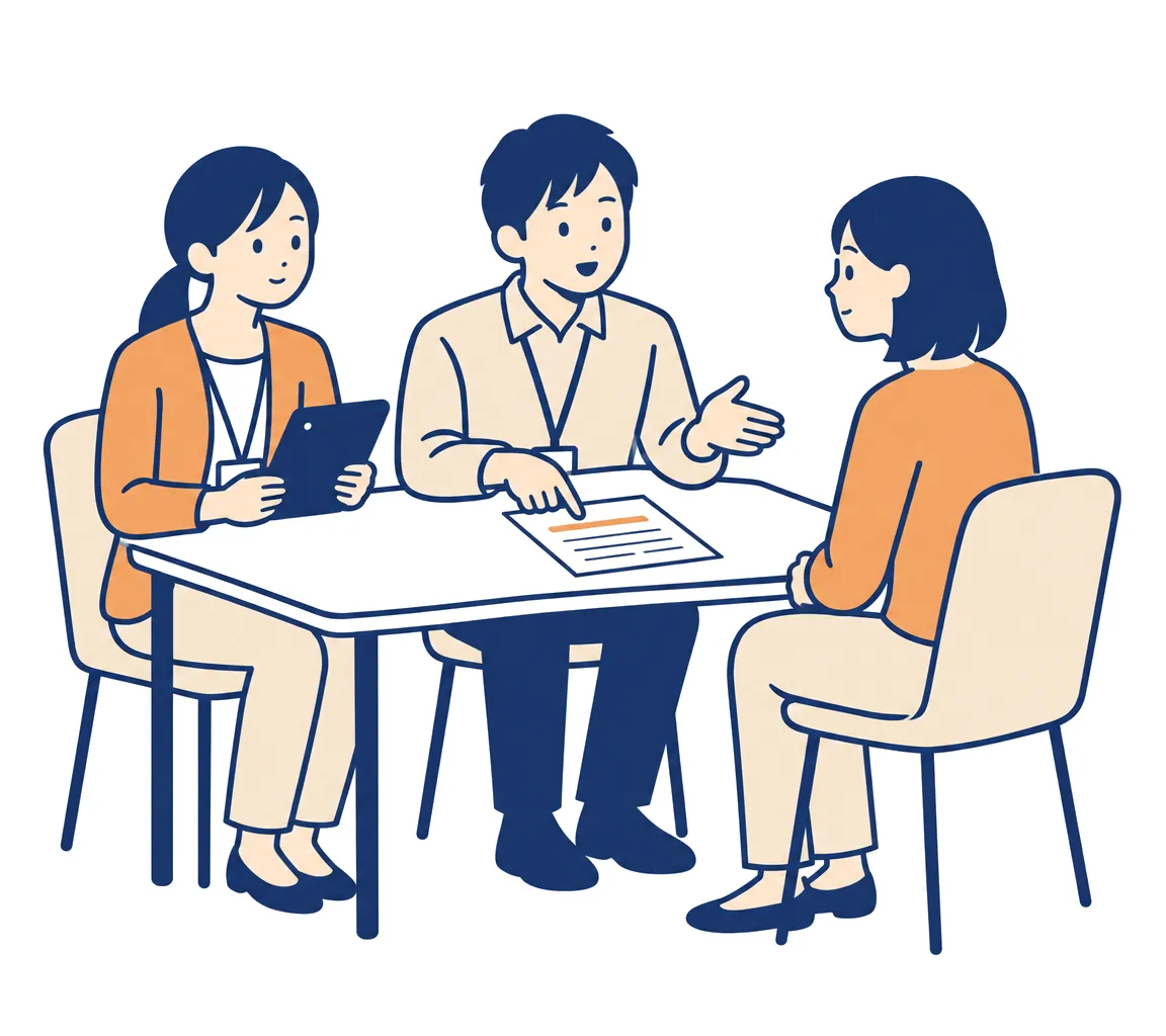 提案してきた相手に、担当者が用紙の項目を指しながら質問している