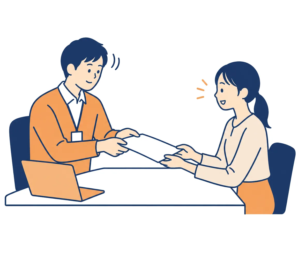 1枚の資料を読んだ上司がうなずき、担当者に返している